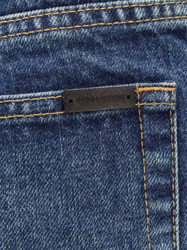 Jeans in cotone con patch logo posteriore