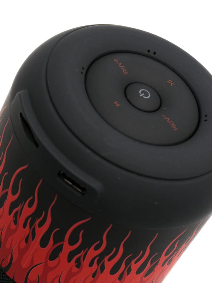 Blck speaker with red flames and white logo